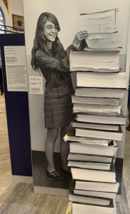 Woman by a stack of books